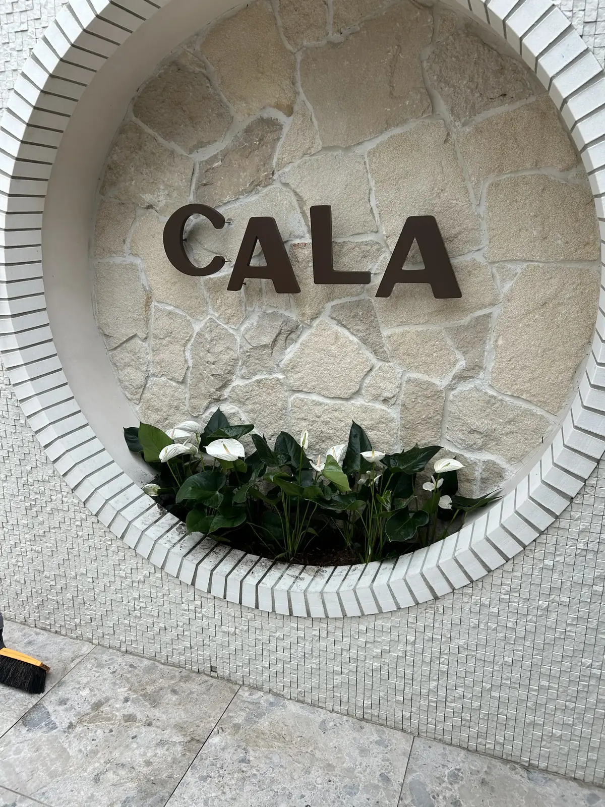 Landscaping Parramatta — stone feature wall with new planting at a commercial entry