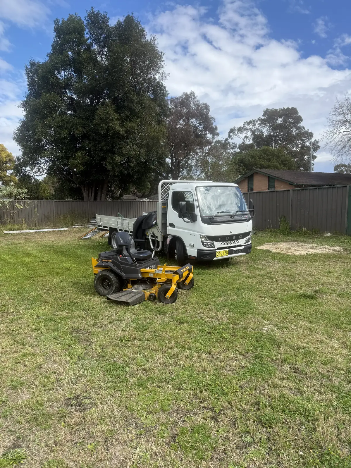 Greater Sydney Landscapes ute and ride-on mower on a job in Western Sydney